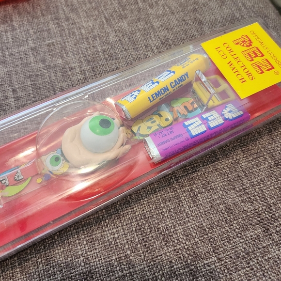 PEZ -  LCD Watch Psychedelic Green Eye Tan Hand Mint in Original Case. - Picture 2 of 3